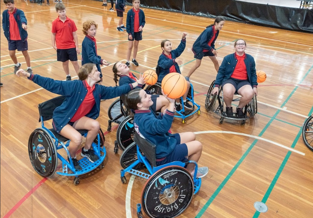 Students participate in a Wheelchair Basketball activation site at the GECC Come and Try day in April 2021.